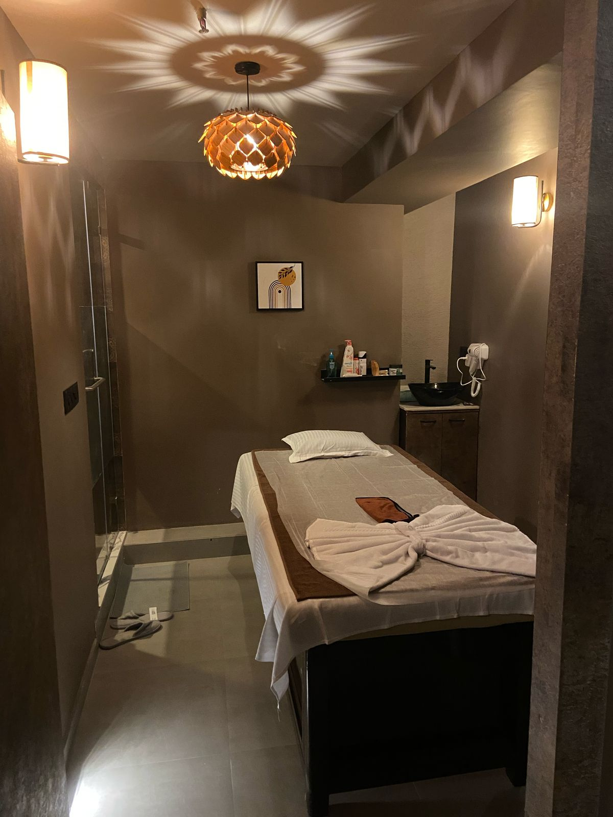 Modern spa room at Ella Spa with soft lighting and comfortable massage tables